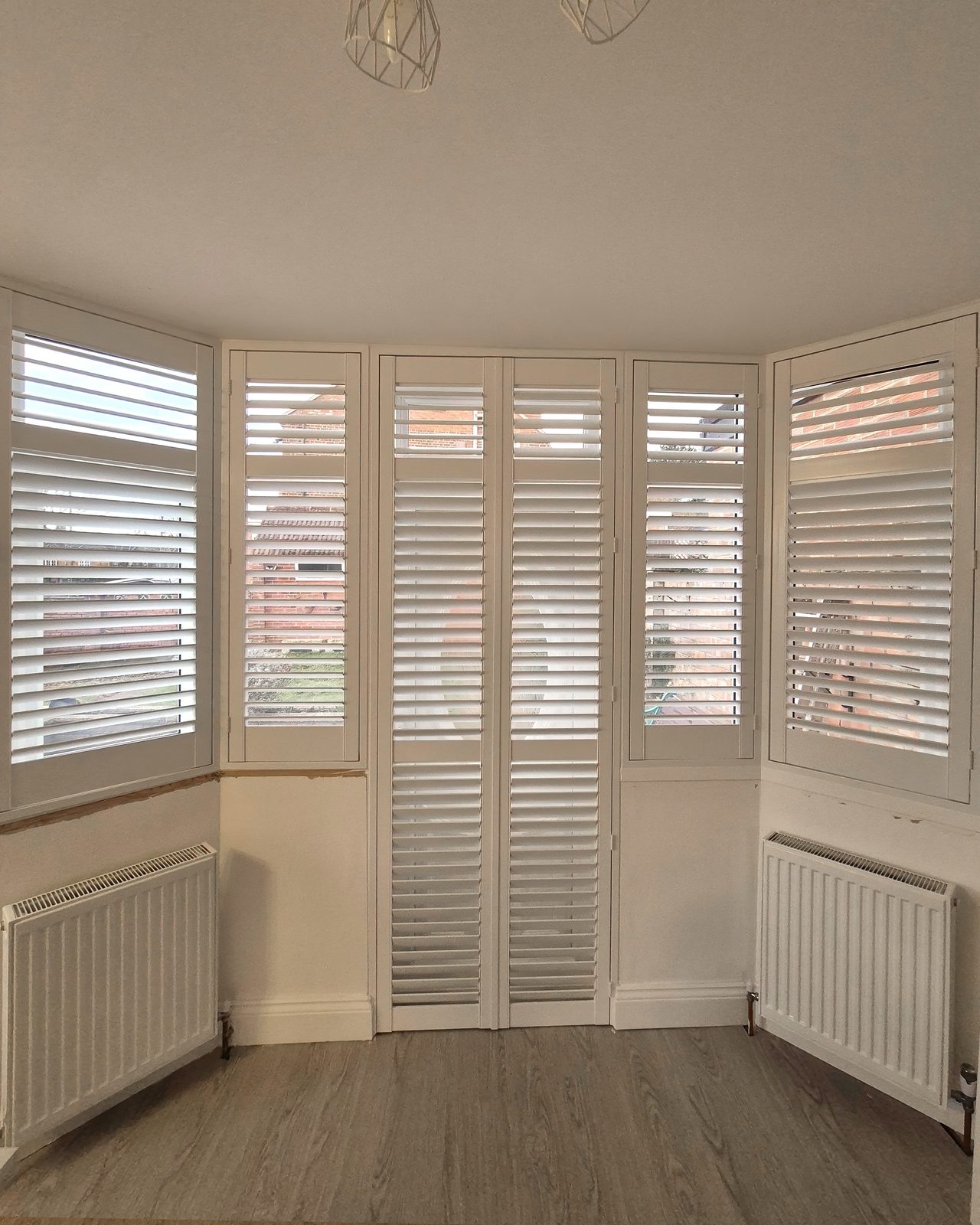 Angled bay window shutters fitted in Kesgrave