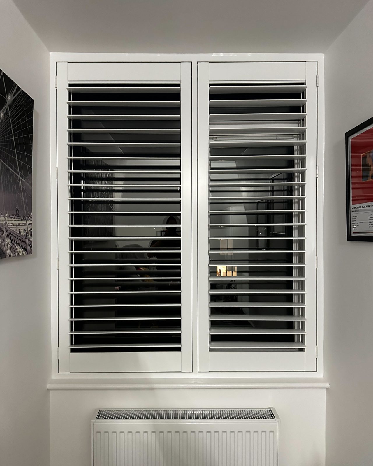 Blackout-style bedroom shutters with closed louvres in Ipswich