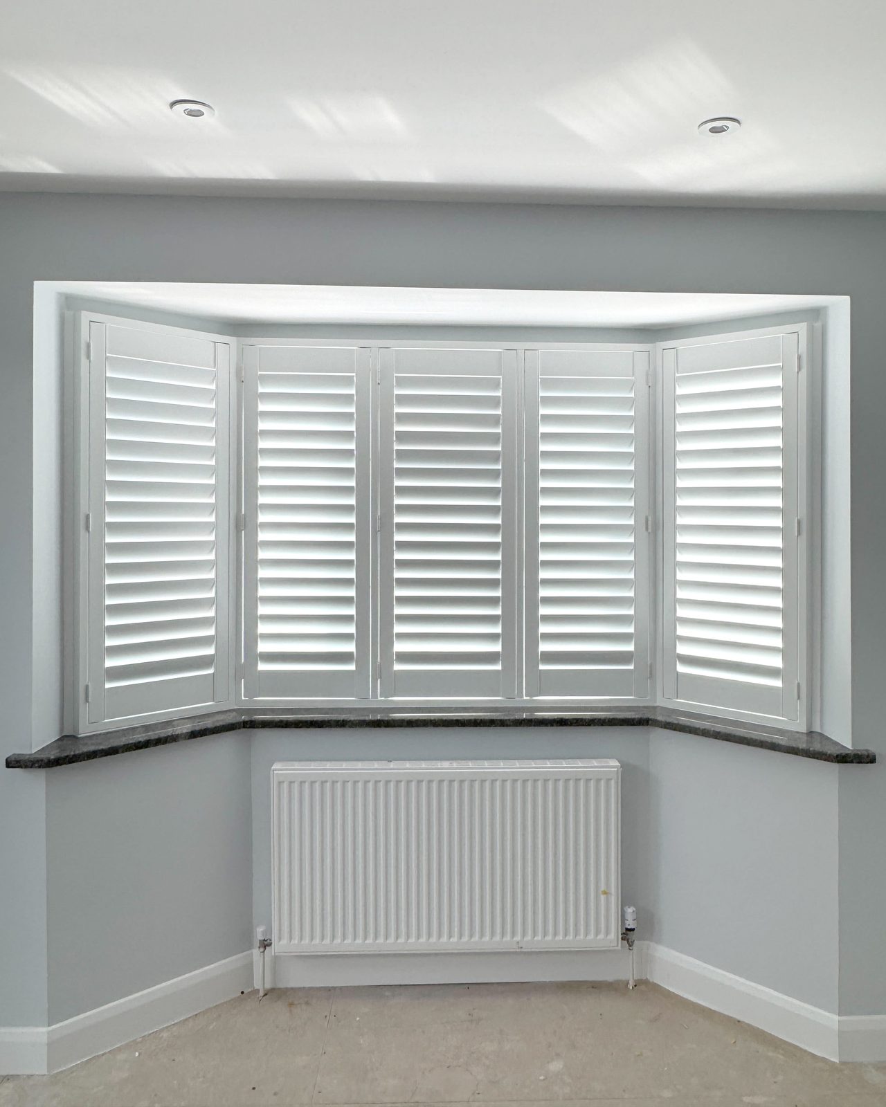 Square bay window shutters in an Ipswich 1930s home