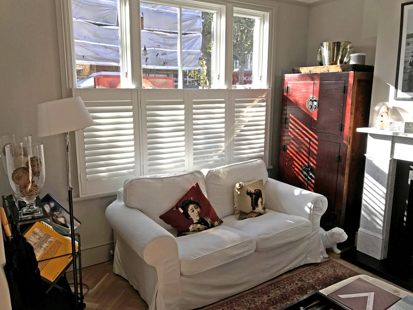 Plantation shutters fitted to a bay window in an Ipswich living room