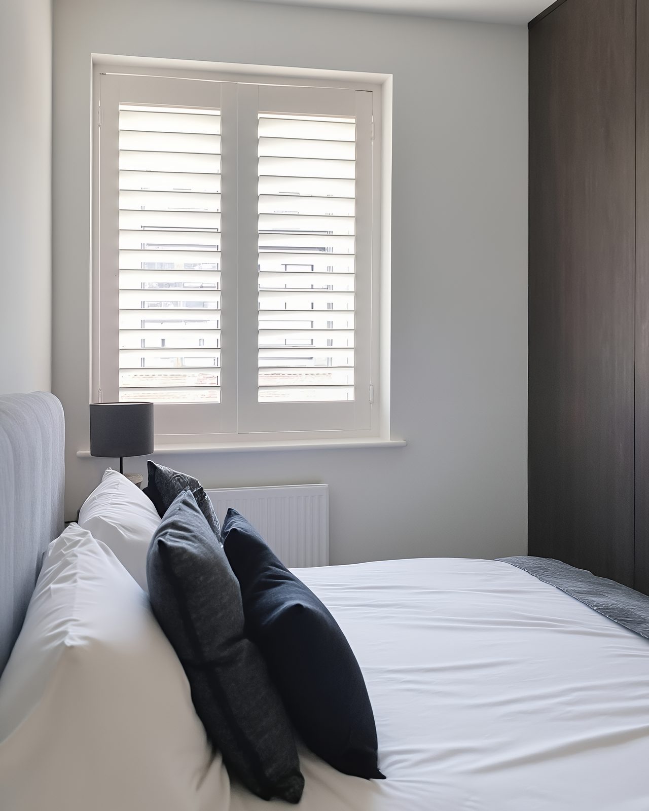 Bedroom window shutters in an Ipswich house