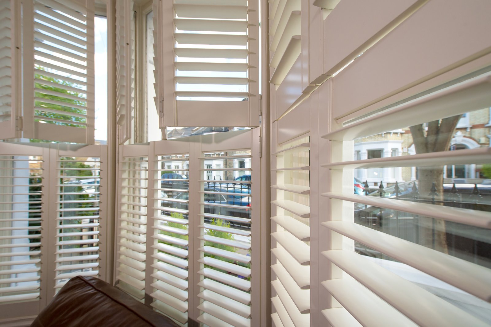 Living room bay window shutters in an Ipswich home