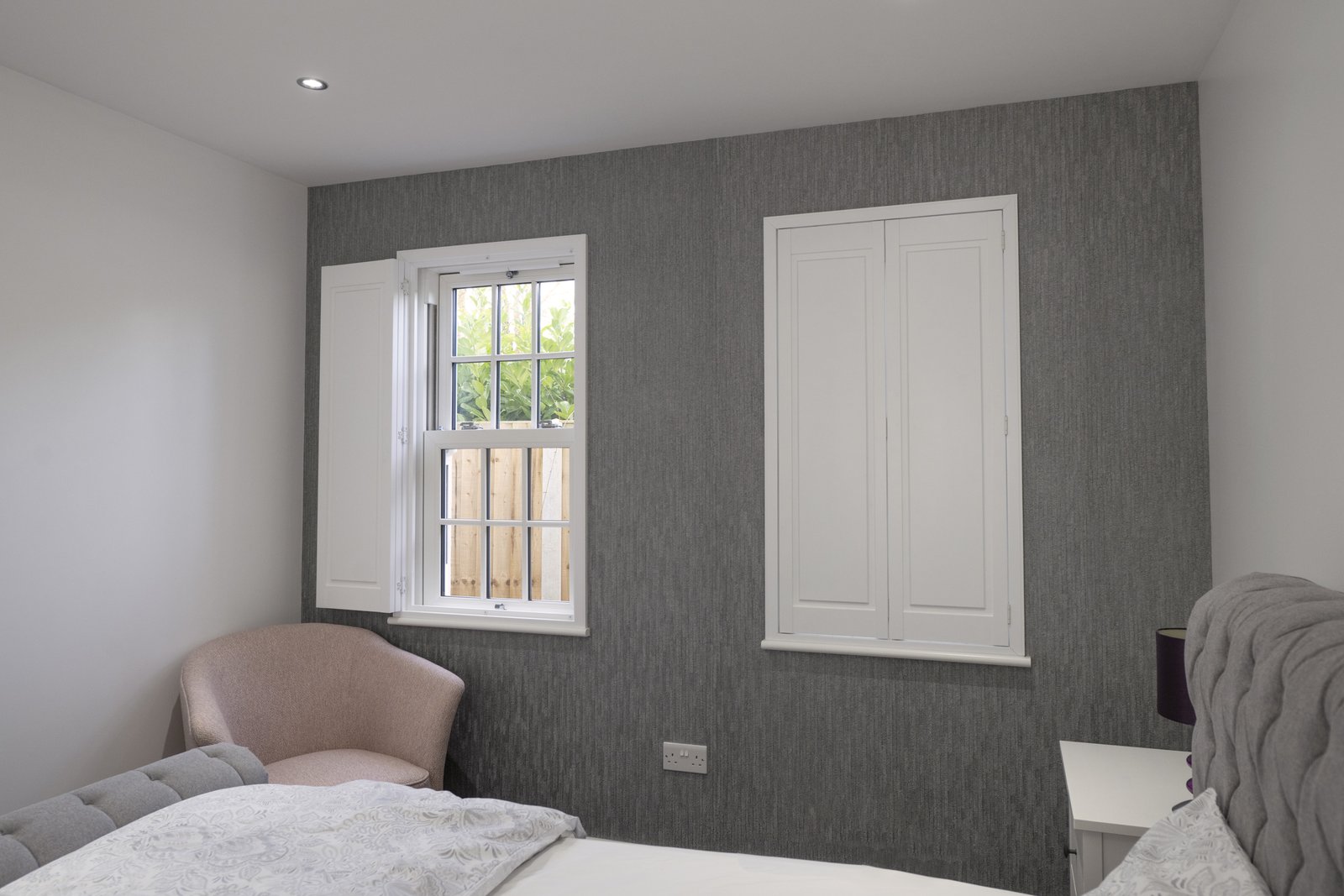 White shutters fitted in a Suffolk bedroom