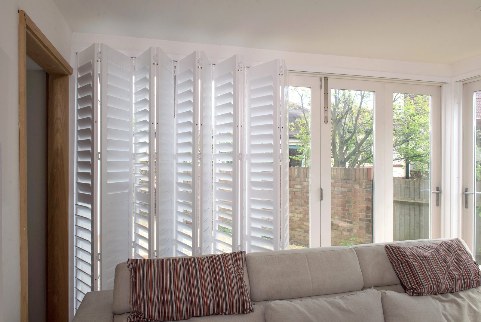 Full height shutters in a Suffolk conservatory