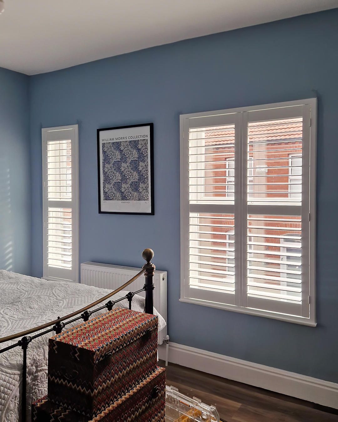 Endura waterproof shutters in a blue Ipswich bedroom