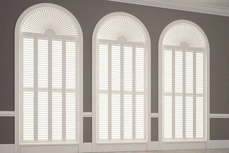 Bespoke shaped shutters fitted to three arched windows in Ipswich