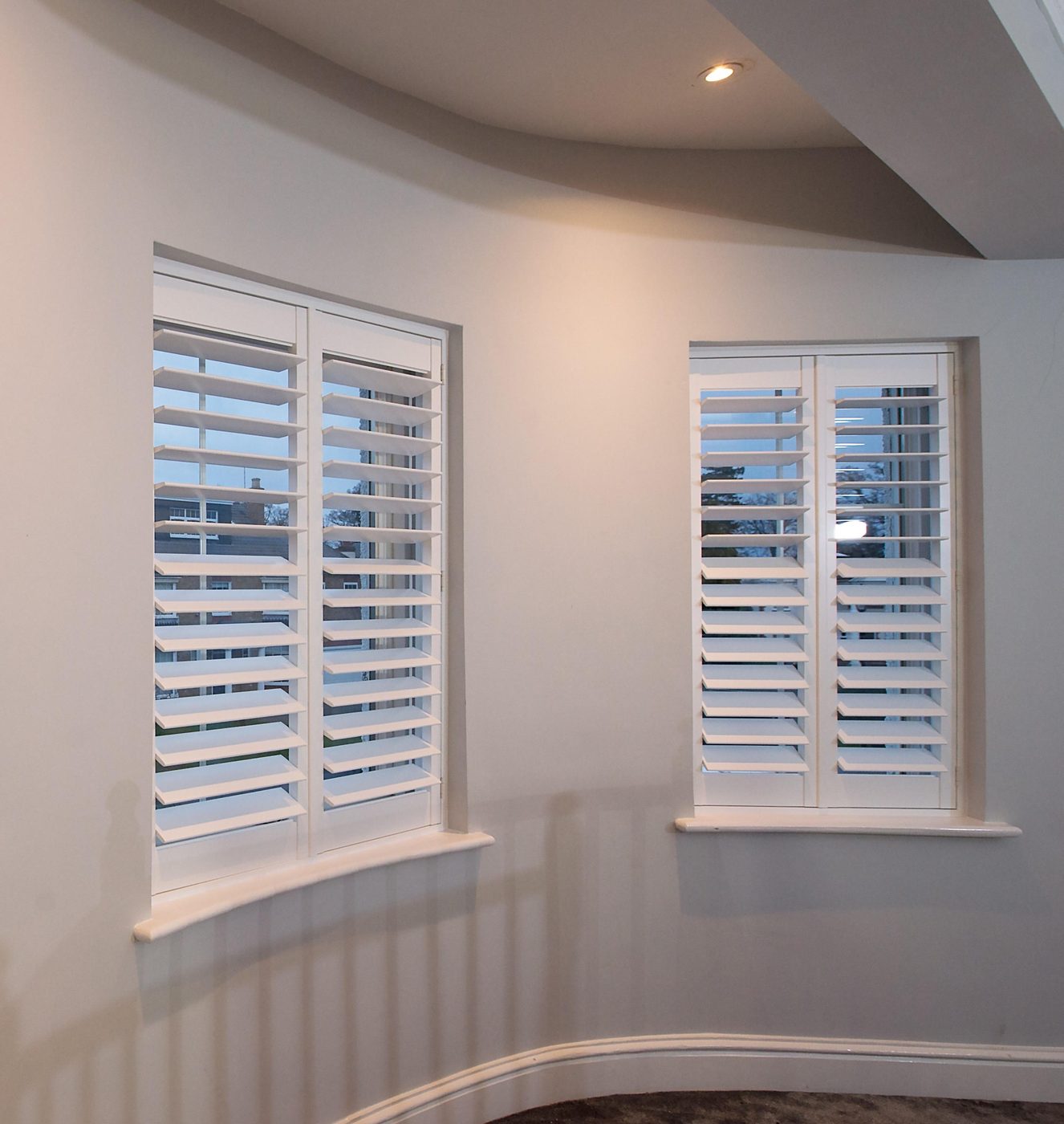 Endura shutters fitted to a bay window in a Suffolk home