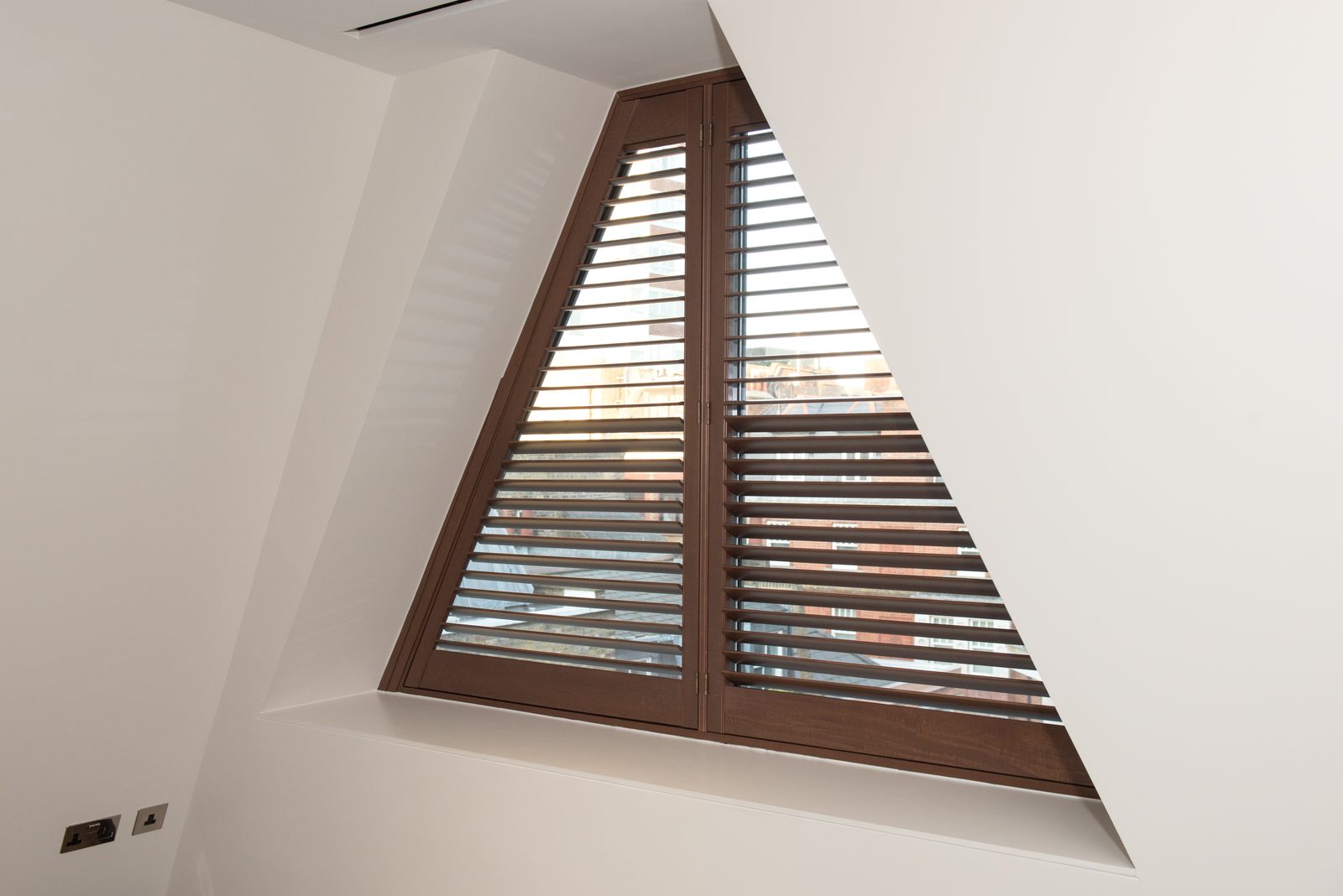 Triangle gable window shutters in a Suffolk property