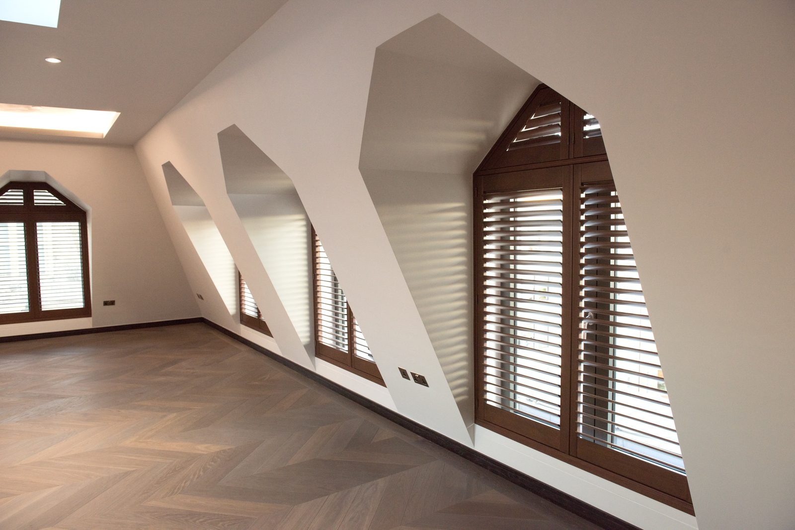 Shaped apex shutters in a Suffolk loft conversion