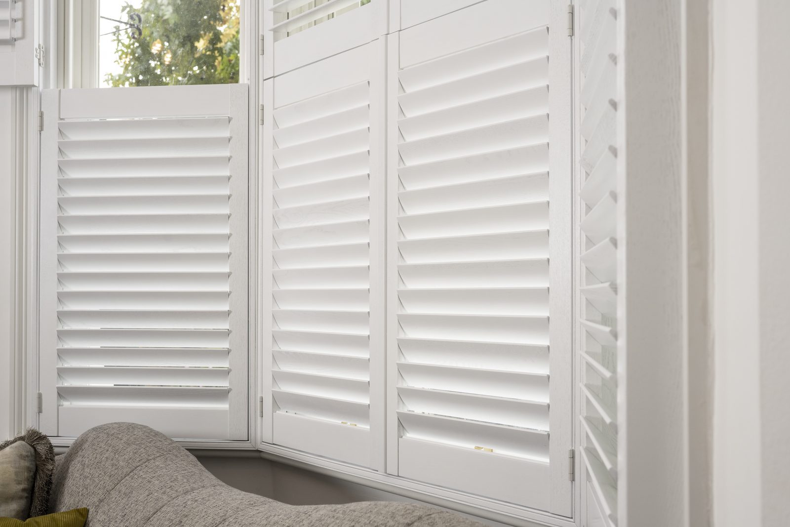 Cafe style shutters in a Suffolk bedroom